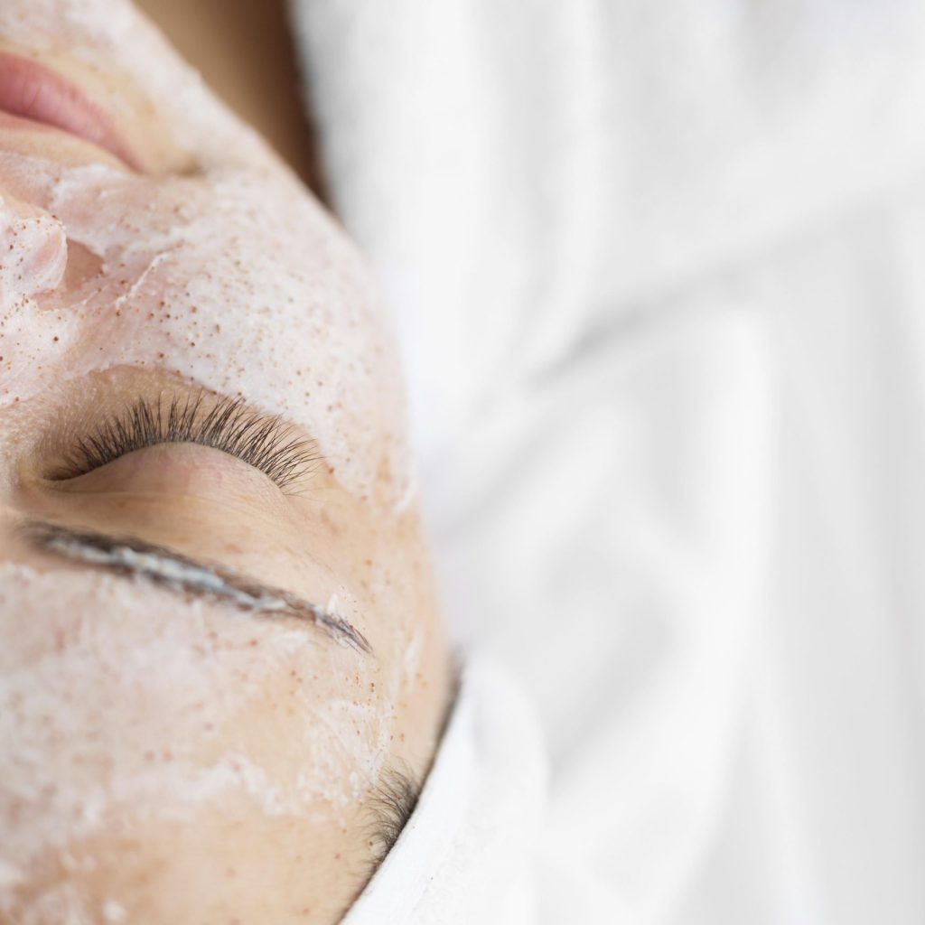 close-up-woman-using-face-cream